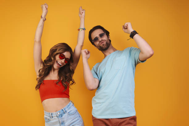 istock Beautiful young couple in eyeglasses having fun 1333946692