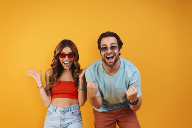istock Beautiful young couple in eyeglasses having fun 1333946697