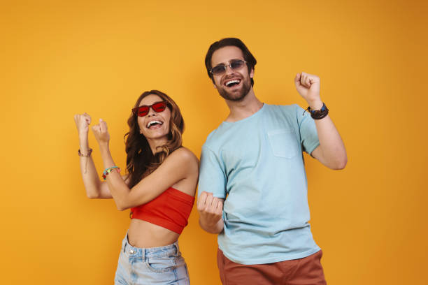 istock Beautiful young couple in eyeglasses having fun 1333946711