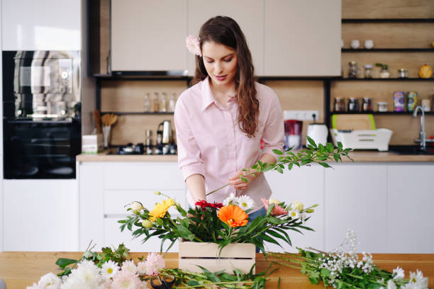 istock Beautiful florist arranging a flower composition 1333946775