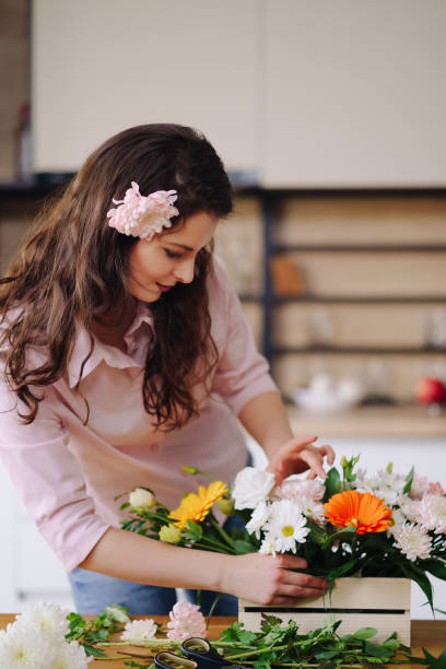 istock Beautiful florist arranging a flower composition 1333947322