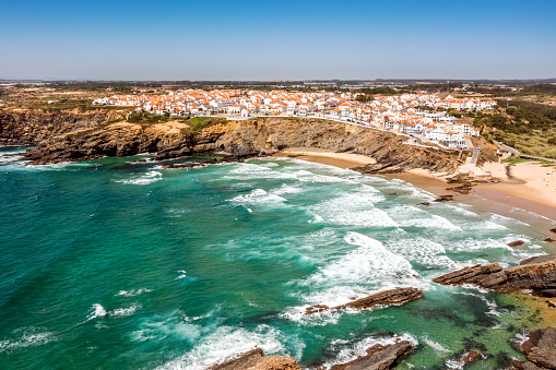 Vista aérea de Zambujeira do Mar - encantadora ciudad en acantilados junto al Océano Atlántico en Portugal photo