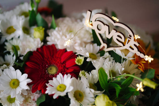 istock Flowers background with love is inscription 1333948516