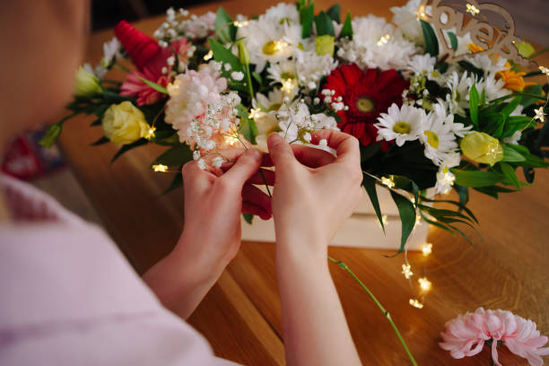 istock Beautiful florist arranging a flower composition 1333948526