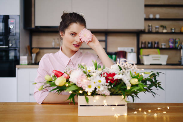 istock Beautiful florist arranging a flower composition 1333948540