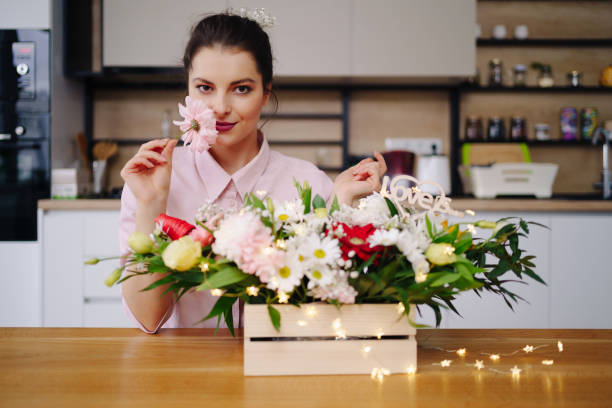istock Beautiful florist arranging a flower composition 1333948545