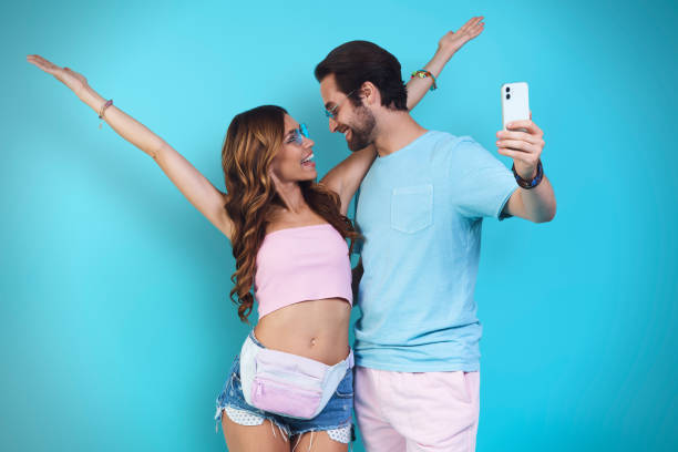 istock Beautiful young smiling couple making selfie 1333948553