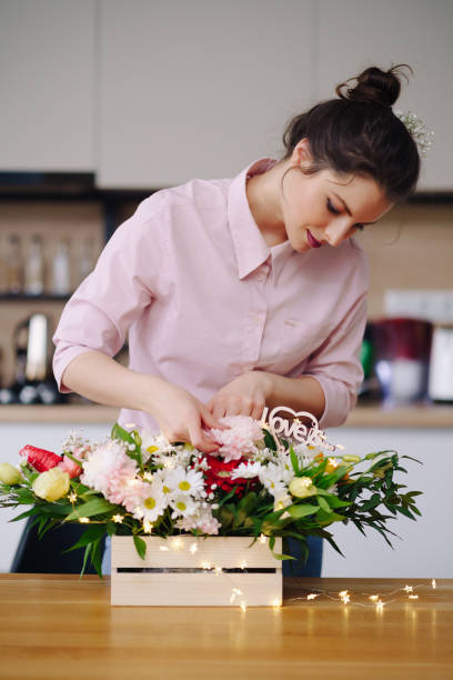 istock Beautiful florist arranging a flower composition 1333948558