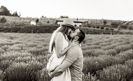 Happy couple enjoying in their love at a lavender field