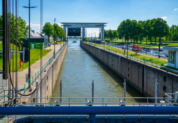 istock Ship passing a princess Beatrix sluice in the Lek channel, Netherlands 1333953466