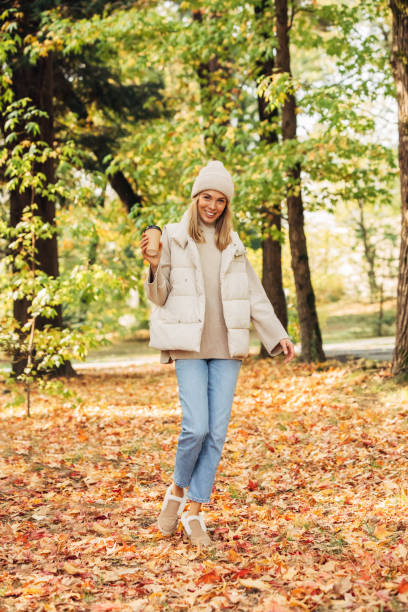 istock Beautiful woman holding leaves 1333954610
