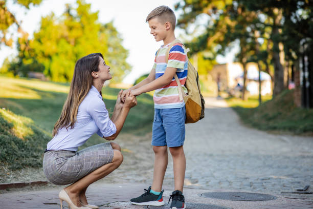 istock Caring mother accompanies her son to school 1333954746