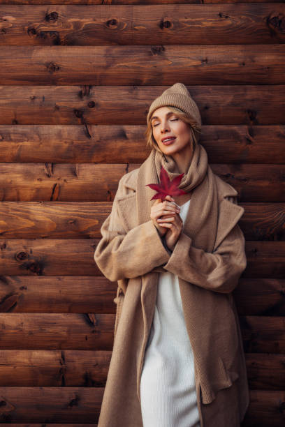 istock Beautiful woman holding a leaf 1333955664