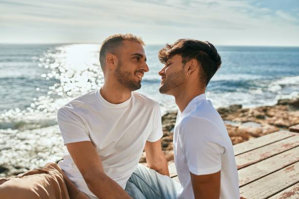 istock Romantic gay couple at the beach. 1333956310