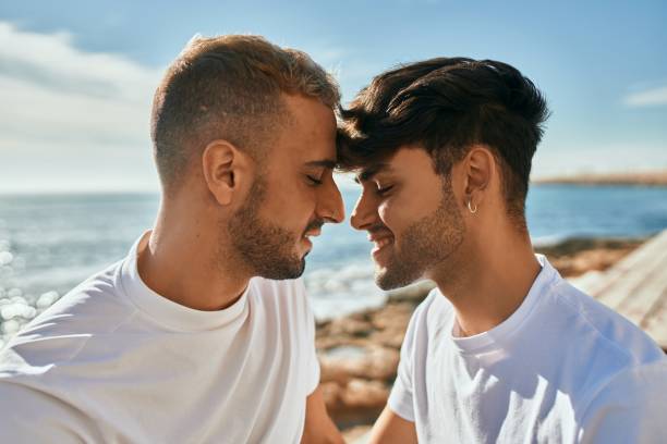 istock Romantic gay couple at the beach. 1333956311