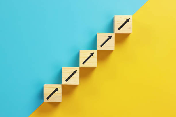 istock wooden block cube stacking as step stair. Business concept growth success process 1333956593