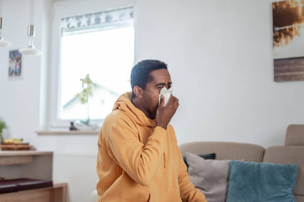 istock Adult man blowing nose 1333957409