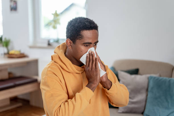 istock Adult man blowing nose 1333957500