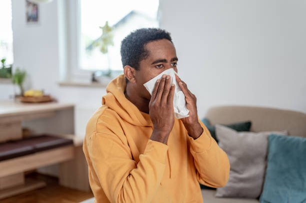 istock Adult man blowing nose 1333957502