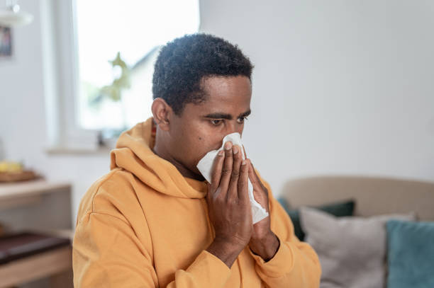 istock Adult man blowing nose 1333957514