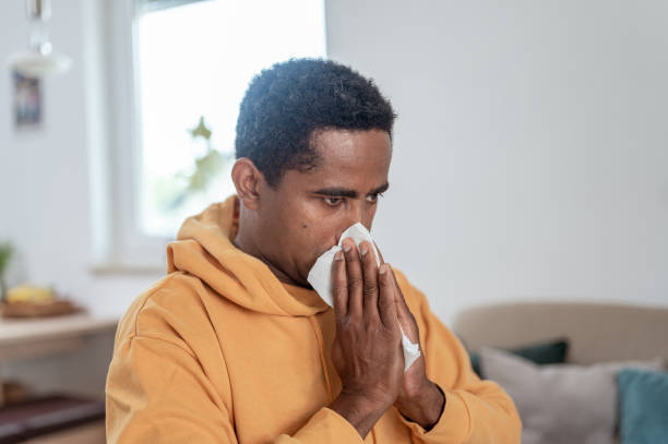 istock Adult man blowing nose 1333957538