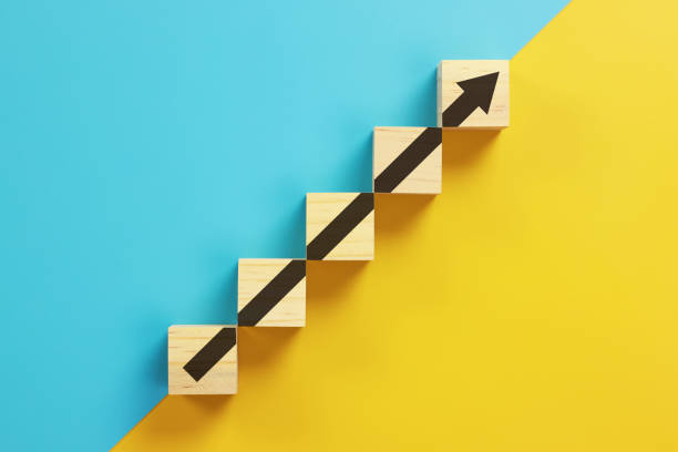 istock wooden block cube stacking as step stair. Business concept growth success process 1333957676