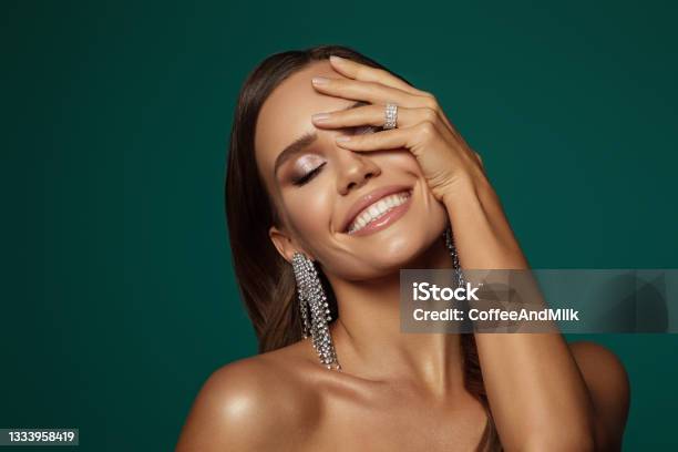 Beautiful Girl With Earrings And Perfect Makeup Stock Photo - Download Image Now - Fashion Model, Happiness, Earring