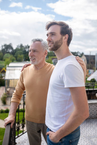 istock Dad and son spending weekend at the country side and looking happy 1333958486