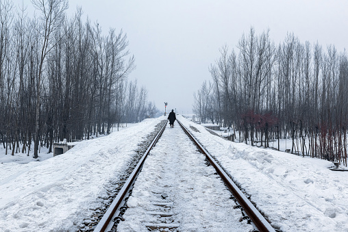 Snow covered Banihal – Baramulla train track after receiving seasons heavy snowfall, Kashmir, India.