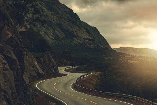 istock Winding Road Through Rocky Norwegian Landscape 1333959158