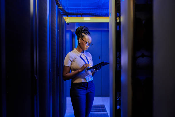 istock Shot of a young female engineer using a digital tablet while working in a server room 1333959187