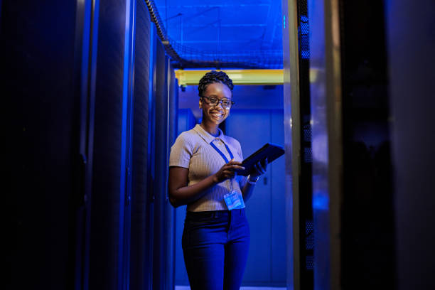 istock Shot of a young female engineer using a digital tablet while working in a server room 1333959189