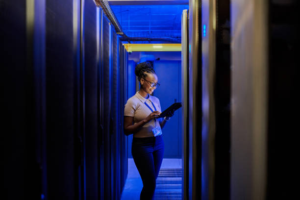 istock Shot of a young female engineer using a digital tablet while working in a server room 1333959190