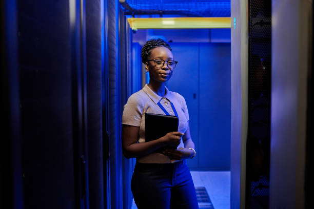 istock Shot of a young female engineer using a digital tablet while working in a server room 1333959192