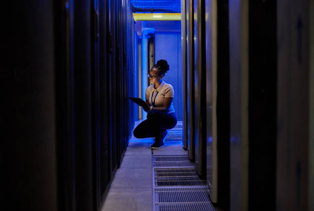 istock Shot of a young female engineer using a digital tablet while working in a server room 1333959197