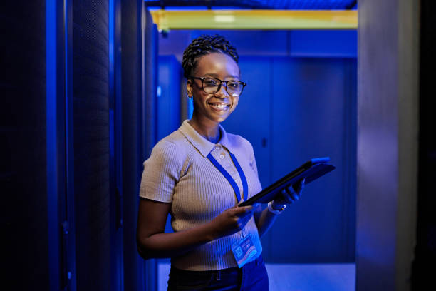 istock Shot of a young female engineer using a digital tablet while working in a server room 1333959198