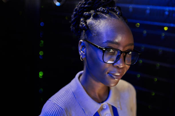 istock Shot of a young female engineer working in a server room 1333959220