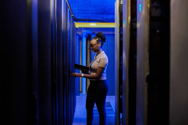 istock Shot of a young female engineer using a digital tablet while working in a server room 1333959223