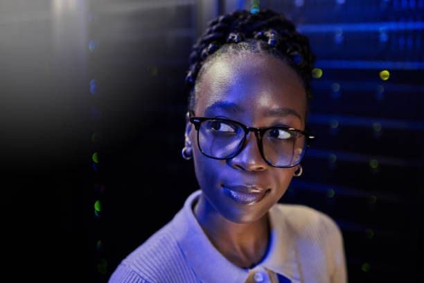 istock Shot of a young female engineer working in a server room 1333959224