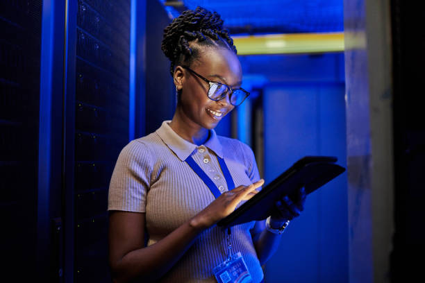 istock Shot of a young female engineer using a digital tablet while working in a server room 1333959666