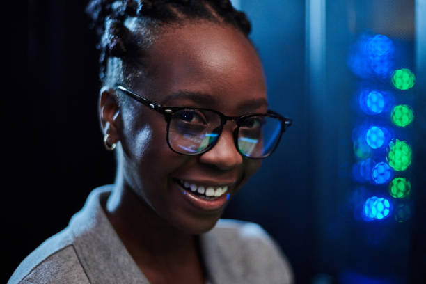 istock Shot of a young female engineer working in a server room 1333959751