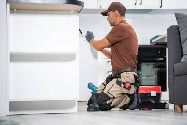 istock Professional Cabinetmaker Finishing New Kitchen Cabinets 1333959830