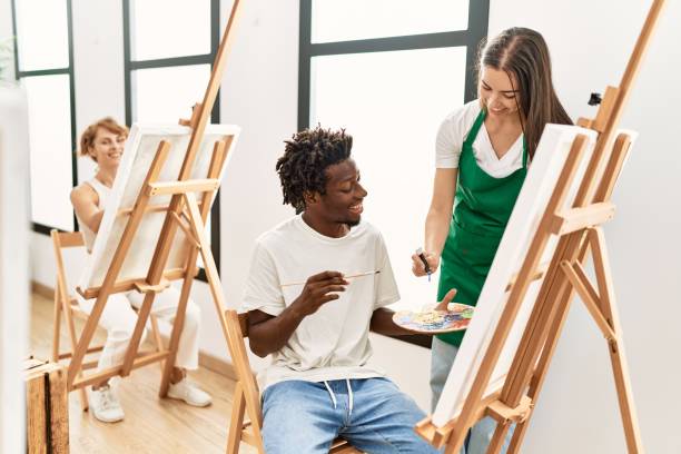 istock Group of people smiling happy drawing at art studio. 1333966003