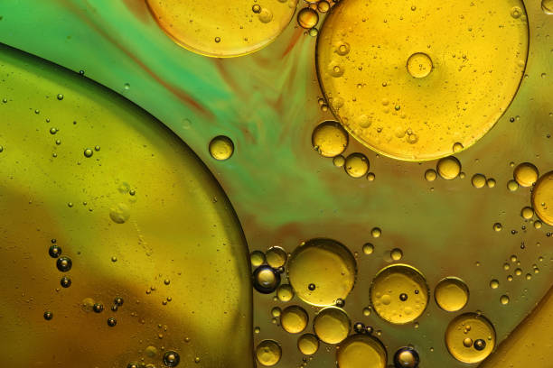 istock oil bubbles with water on glass 1333968018