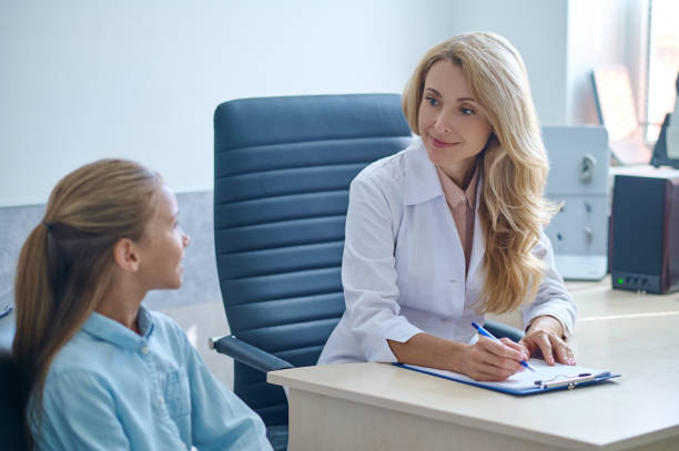 istock Attentive experienced pediatric otolaryngologist receiving a kid 1333968084