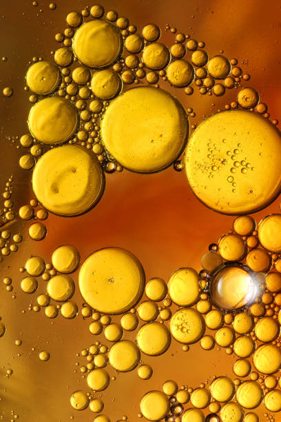 istock oil bubbles with water on glass 1333969249