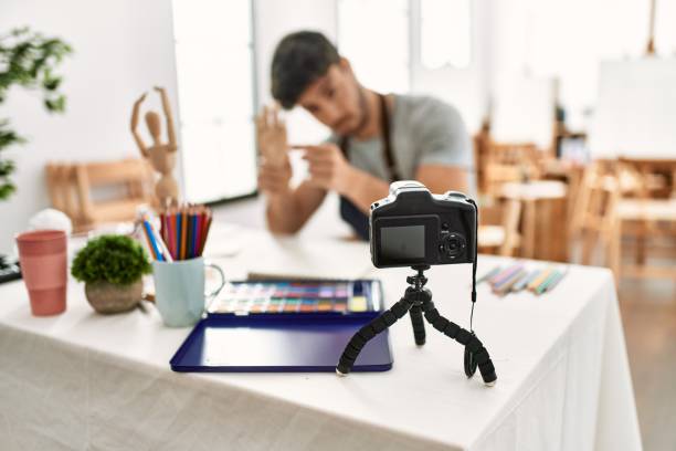 istock Young hispanic artist man smiling happy making online art class at studio. 1333970611
