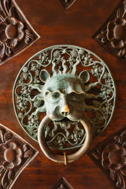 Photo of Vintage ancient door knob as lion head made from bronze