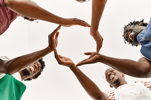 Group of young african american artist man smiling happy doing circle with hands together at art studio.