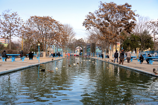 Mazar-i-Sharif, Balkh Province, Afghanistan: leisure time in Rawza / Rauza Park, the center of the city - duck pond and the gates to the Shrine of Ali